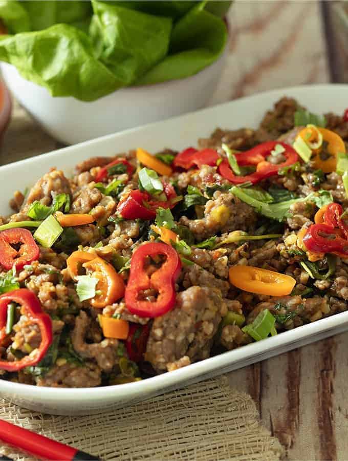 Ground pork and chili stir fry in a white bowl