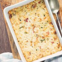 Cauliflower mac and cheese casserole in a white dish overhead view