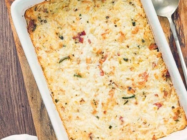 Cauliflower mac and cheese casserole in a white dish overhead view