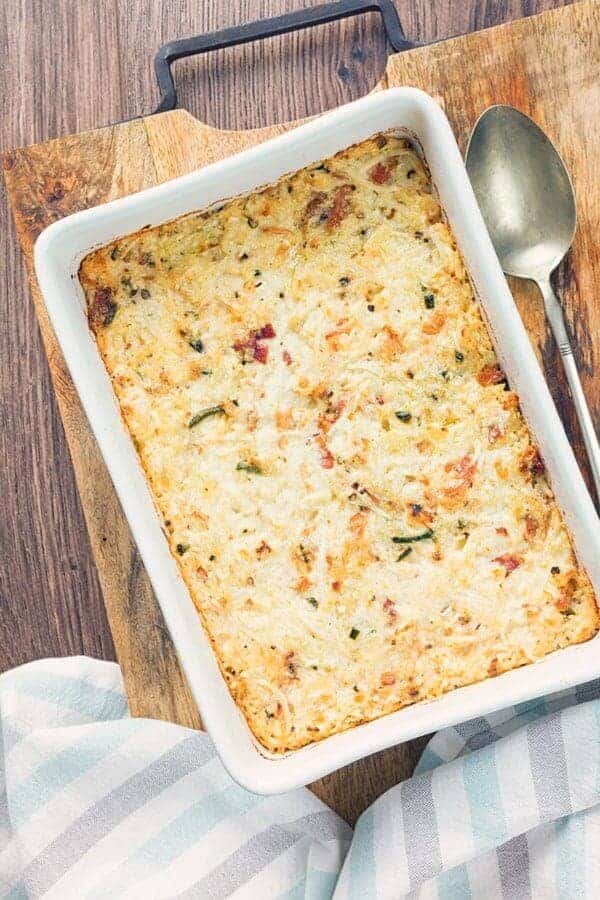 Cauliflower mac and cheese casserole in a white dish overhead view