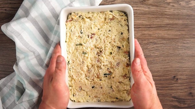 Overhead shot of bacon jalapeno mac and cheese in a white rectangle dish