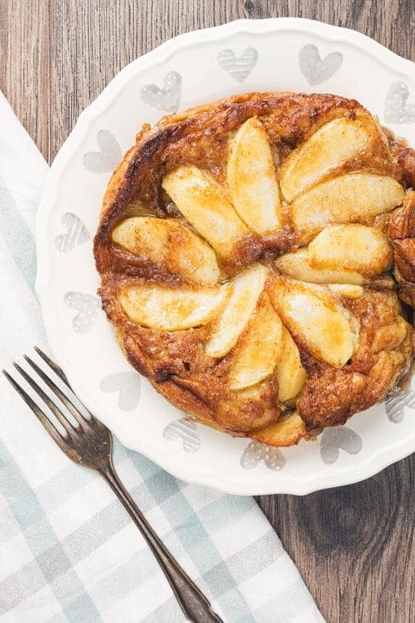 Air Fryer German Apple Pancakes Overhead Shot on a white platter with a fork on the side