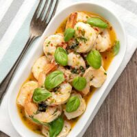 Overhead image of Air Fryer Shrimp Scampi Served on a white plate with a fork sitting to the side