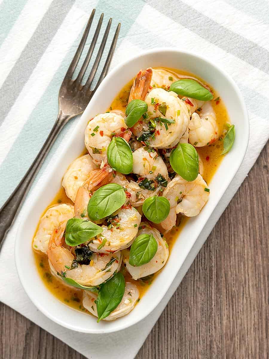 Overhead image of Air Fryer Shrimp Scampi Served on a white plate with a fork sitting to the side