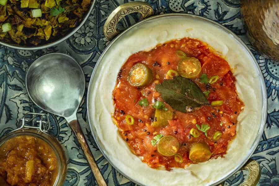 Indian Tomato Salad, a side dish served on Full Fat Yogurt with Serrano peppers and spices. 