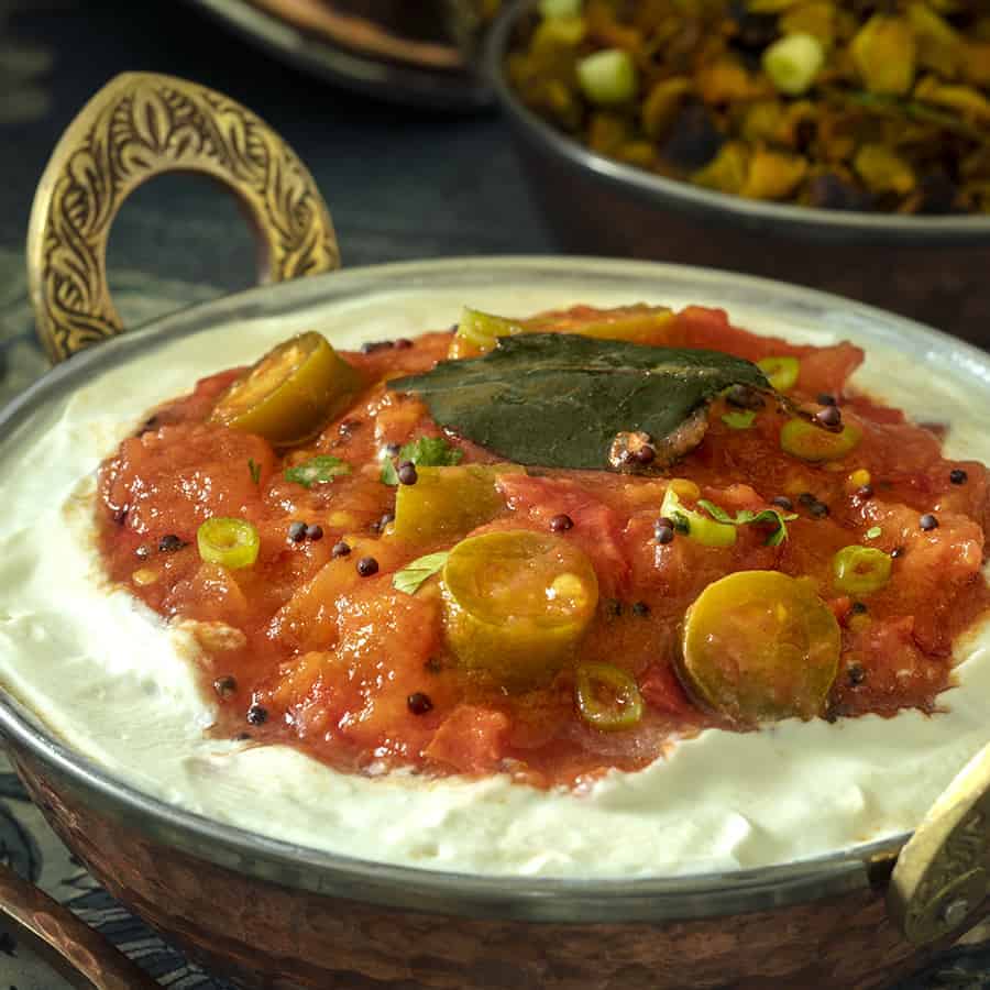 Indian Tomato Salad, a side dish served on Full Fat Yogurt with Serrano peppers and spices. 