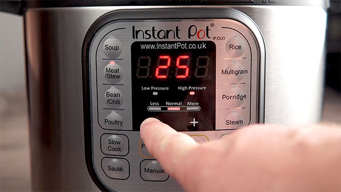 Side shot of setting the Instant Pot to stew for 25 minutes.