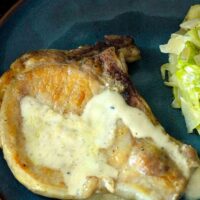 overhead shot of pork chop with mustard sauce