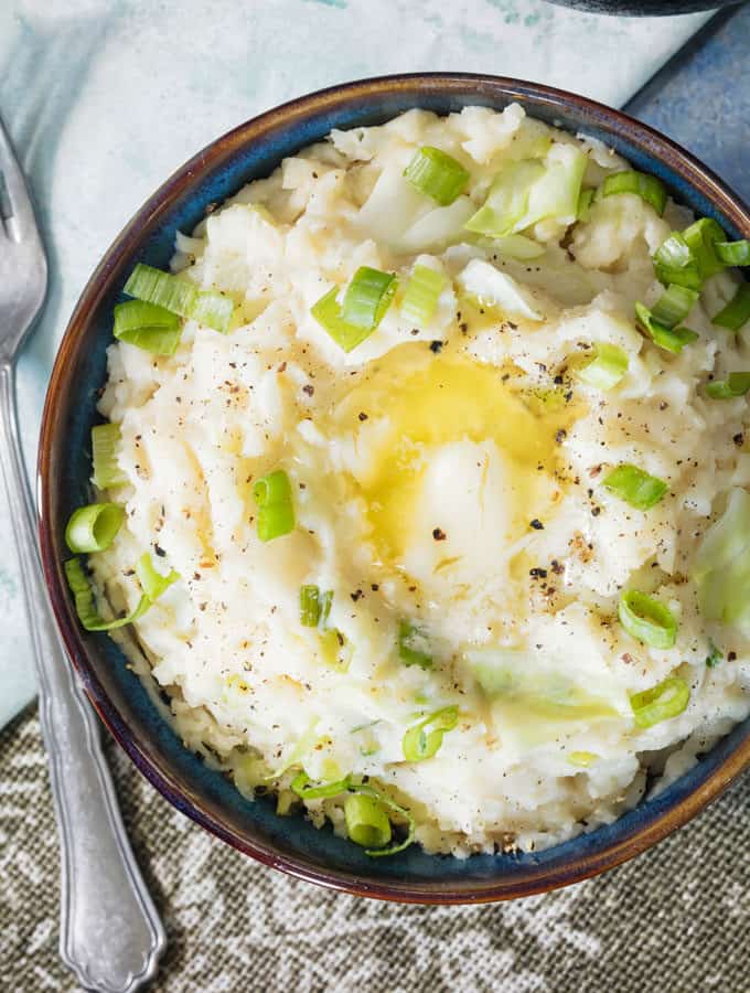 Instant Pot Mashed Potatoes with Cabbage with butter on top overhead view