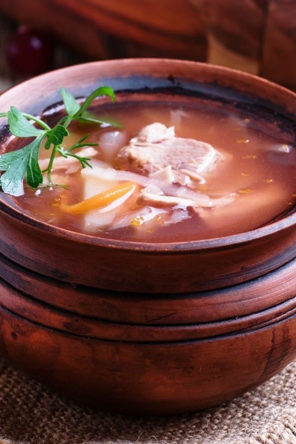 Sauerkraut Soup in a wooden bowl