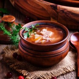 Sauerkraut Soup in a wooden bowl