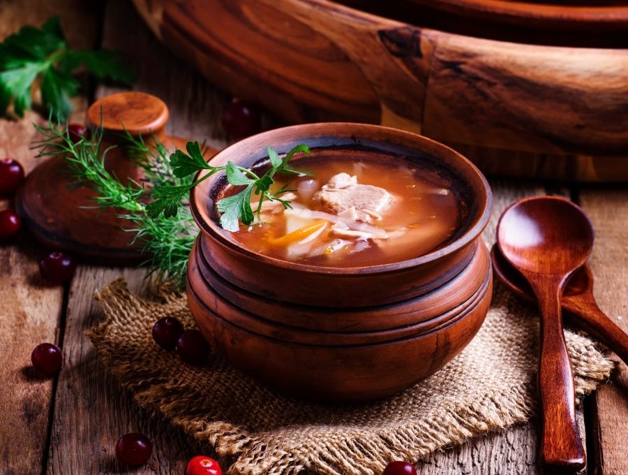 Sauerkraut Soup in a wooden bowl 