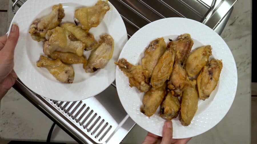 Comparision of the wings cooked in the COSORI Oven Air Fryer Combo (left) compared to a standard air fryer (right).