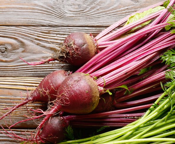 beets to roast on a wooden kitchen table