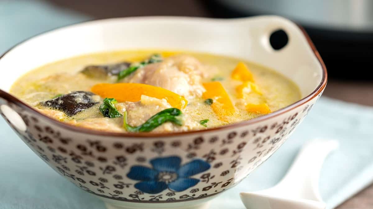 thai green curry in a floral bowl