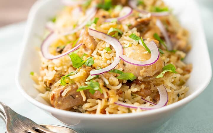 Instant Pot Chicken Biryani Served in a white dish