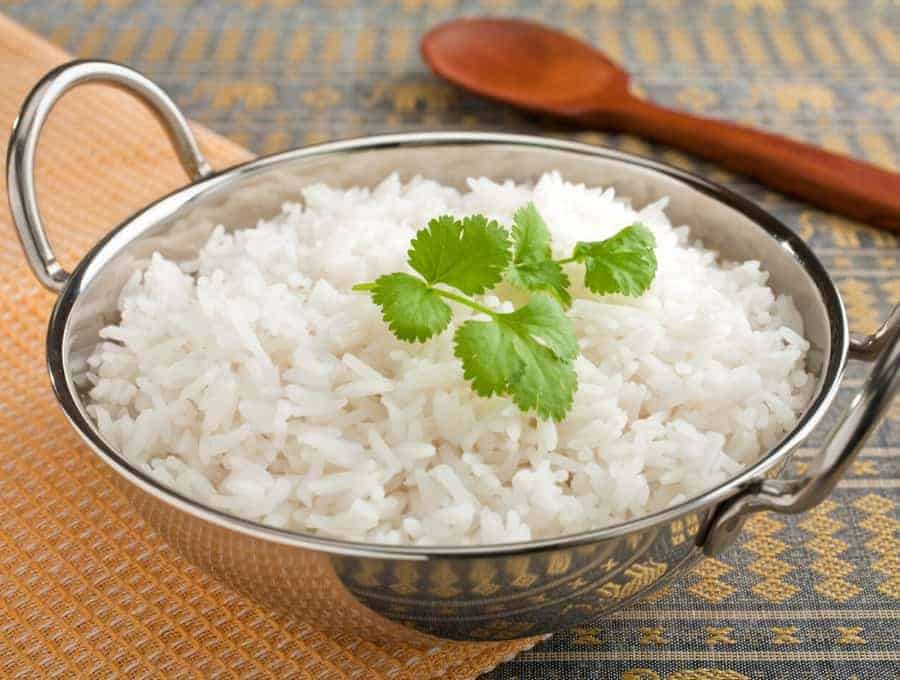 Instant Pot Basmati Rice in a metal bowl with a parsley garnish.