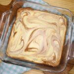 Overhead image of Keto Cheesecake Brownies in a glass pan