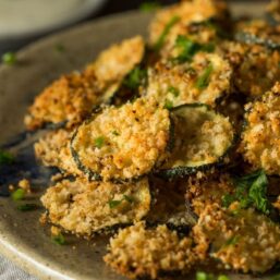 AIr Fryer Zucchini on an earth tone plate