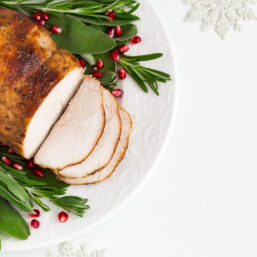 turkey breast with cranberry garnish