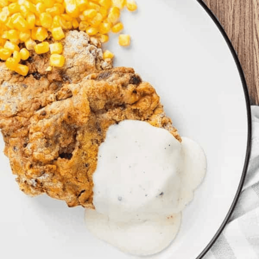 Overhead image of Air Fryer Chicken Fried Steak on a white plate