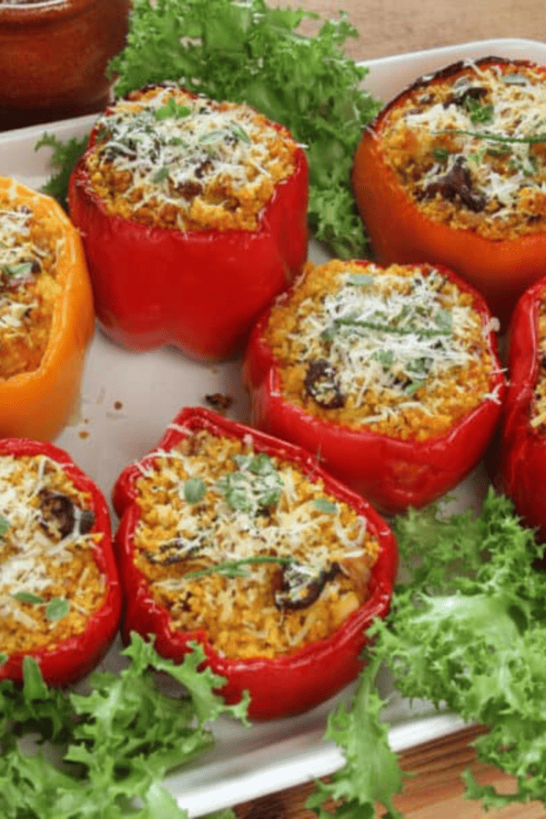 Image of Keto Stuffed Peppers on a white platter with garnish