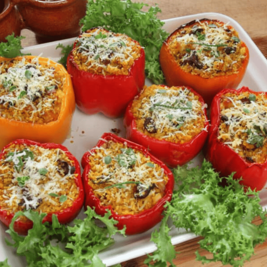 Image of Keto Stuffed Peppers on a white platter with garnish