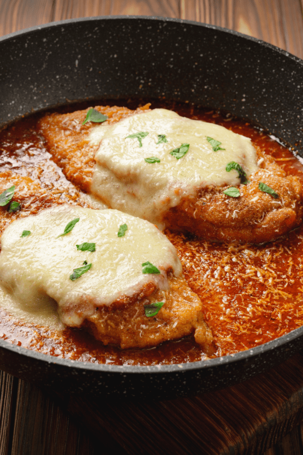 Keto Chicken Parmesan in a large black serving plate