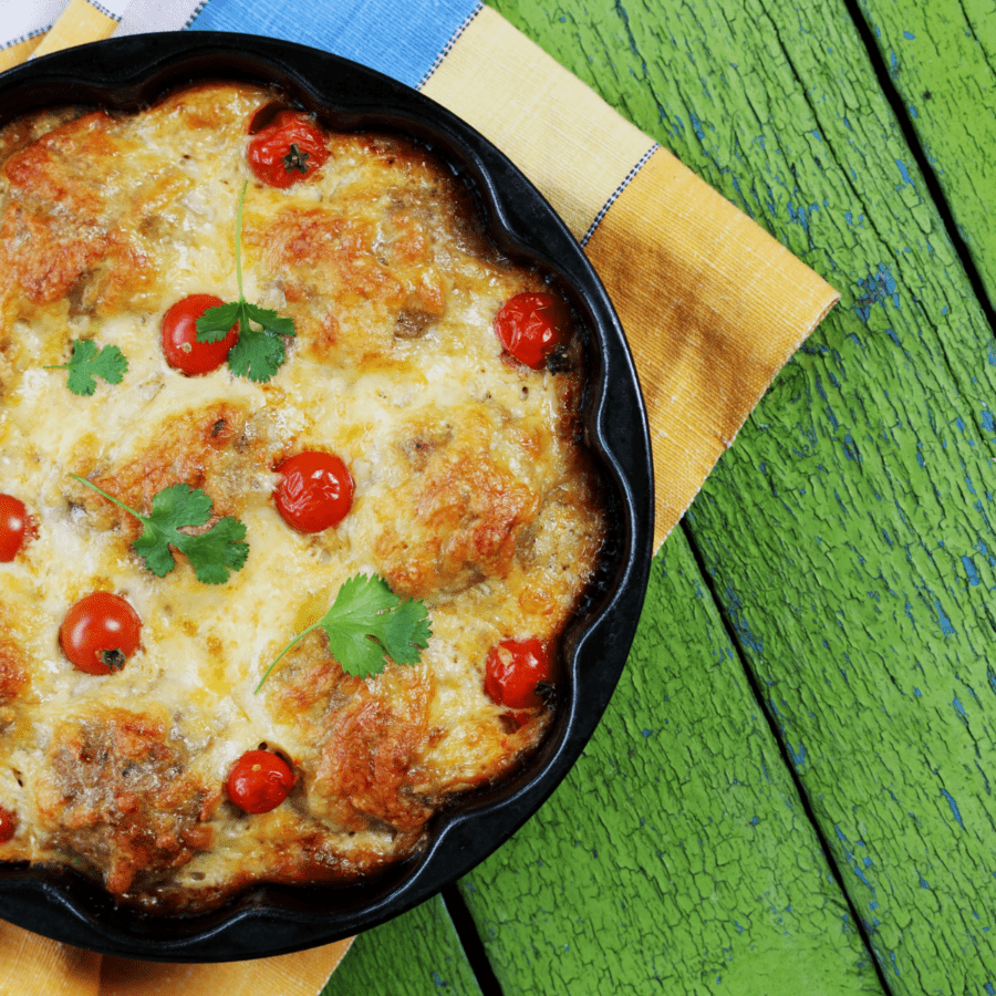 Meatball Casserole in a pan resting on a green background