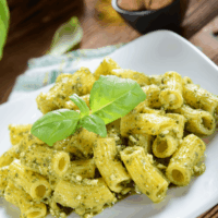 Pesto Pasta served on a square white plate