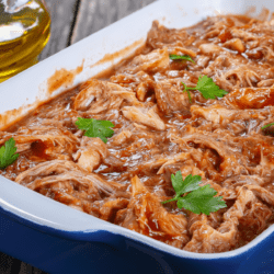 Instant Pot BBQ Chicken in a blue and white baking dish