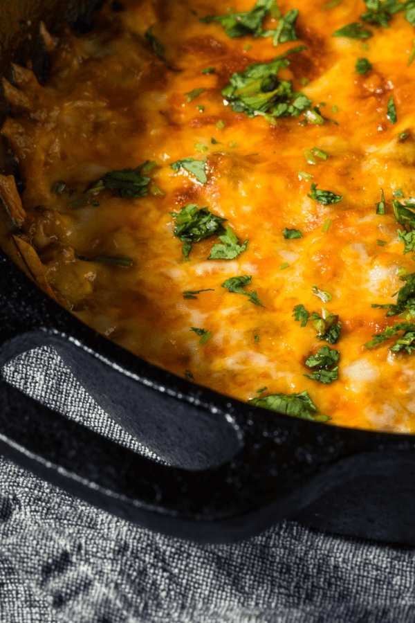 Closeup image of cheeseburger casserole in a castiron skillet with handles