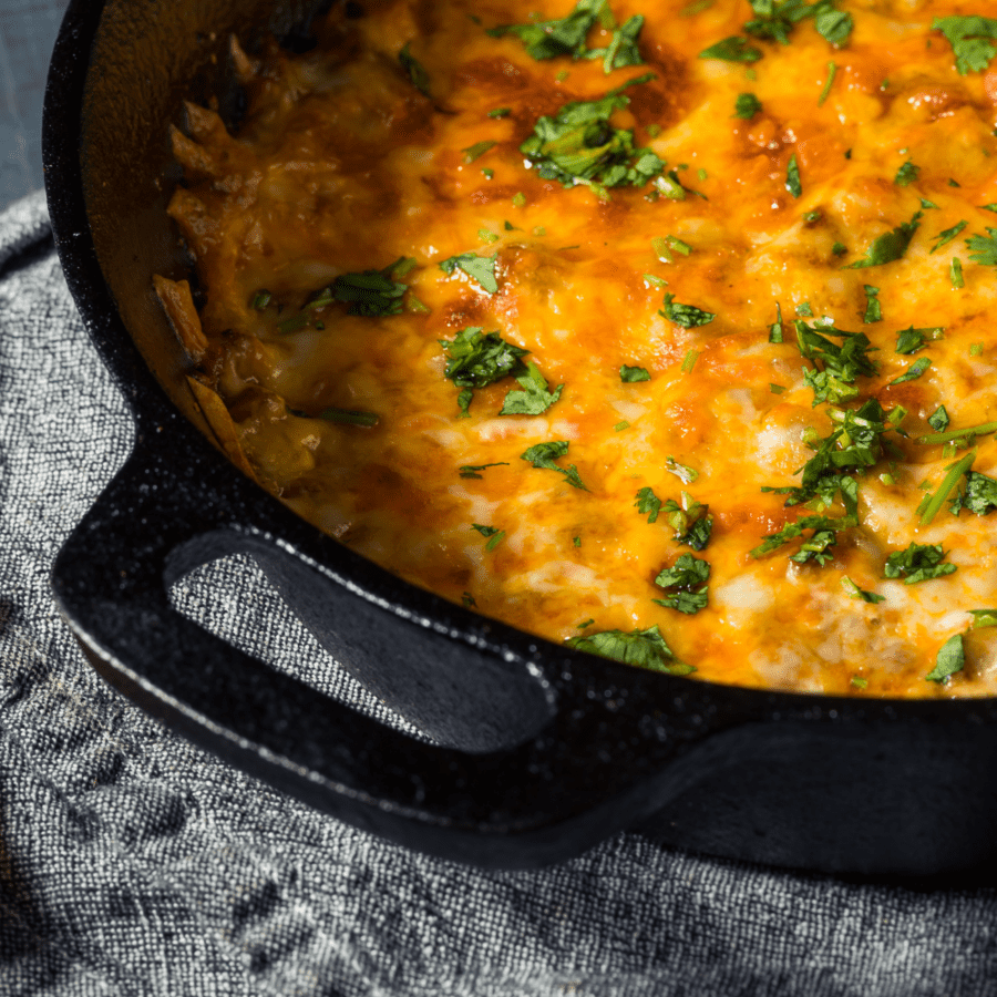 Closeup image of cheeseburger casserole in a castiron skillet with handles