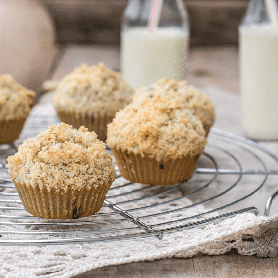 Coffee Cake Muffins on a cooling rack with milk in the background