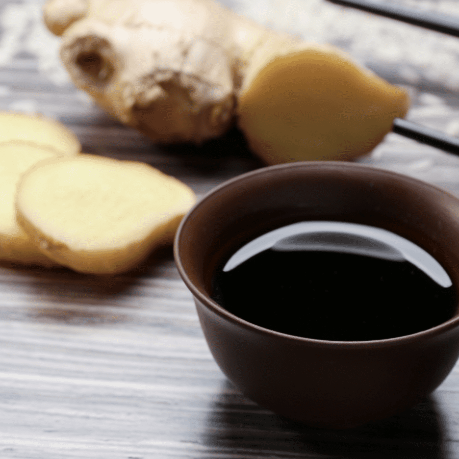 Tofu Marinade in a small bowl with ginger in the background