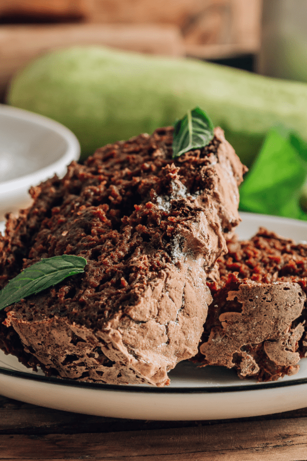 Chocolate zucchini cake on a white plate