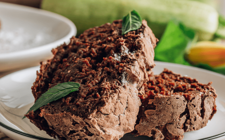 Chocolate zucchini cake on a white plate