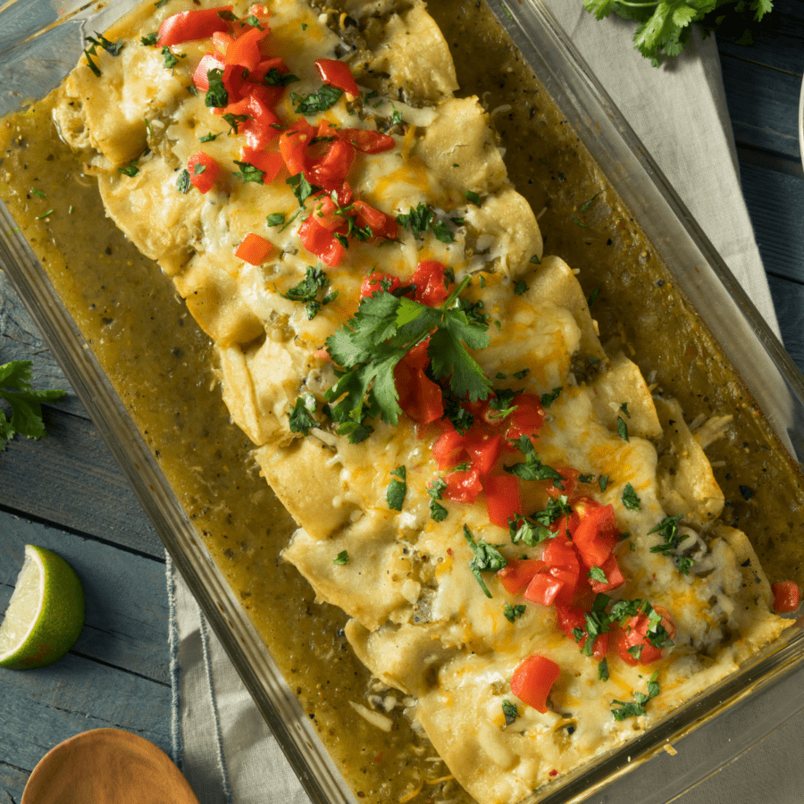 Overhead view of enchiladas suizas in a baking dish