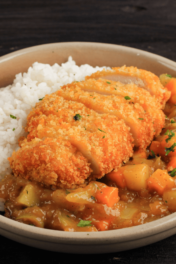 Chicken Katsu Curry served in a pan with rice
