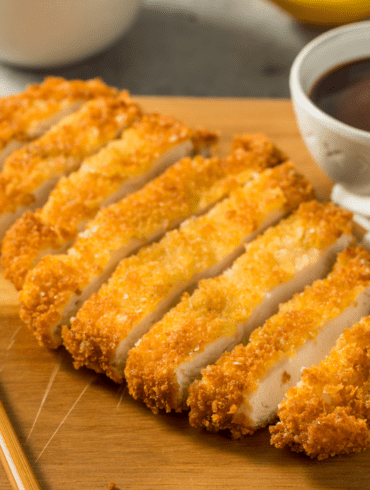 Pork Katsu on a wooden cutting board