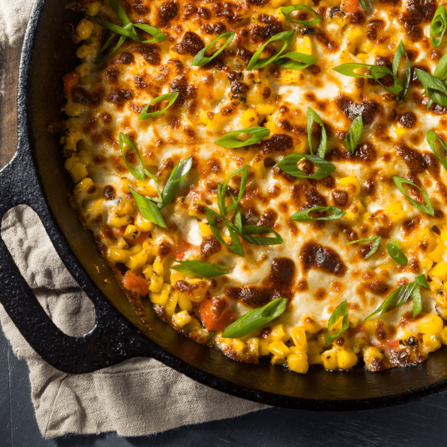 Overhead image of corn dip in a cast iron pan