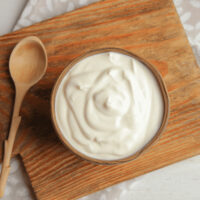 Overhead image of fruit dip in a wooden bowl