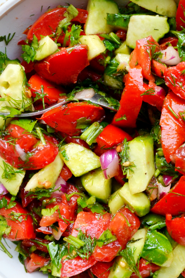 Closeup image of cucumber tomato onion salad