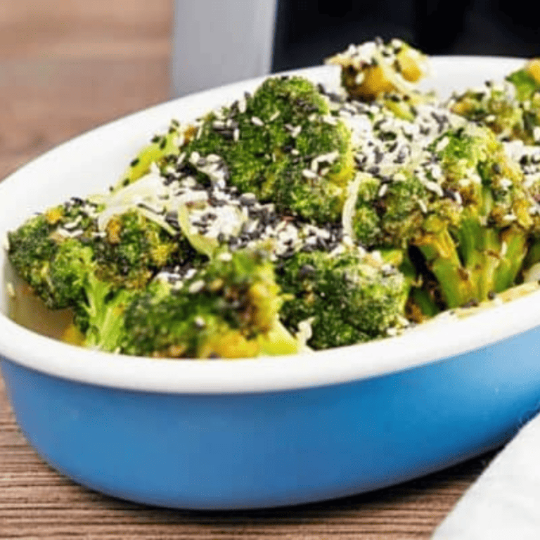 Air Fryer Sesame Ginger Broccoli in a blue casserole dish