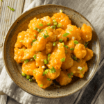 Overhead image of Bang Bang Chicken on a tan plate - 9