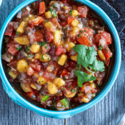 Close Up image of Peach Salsa in a blue bowl
