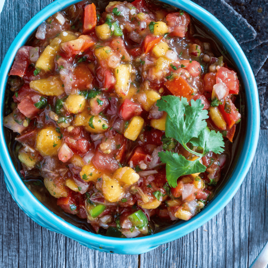Close Up image of Peach Salsa in a blue bowl