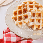 Closeup of Protein Waffles on a white plate and red and white checked napkin - 9