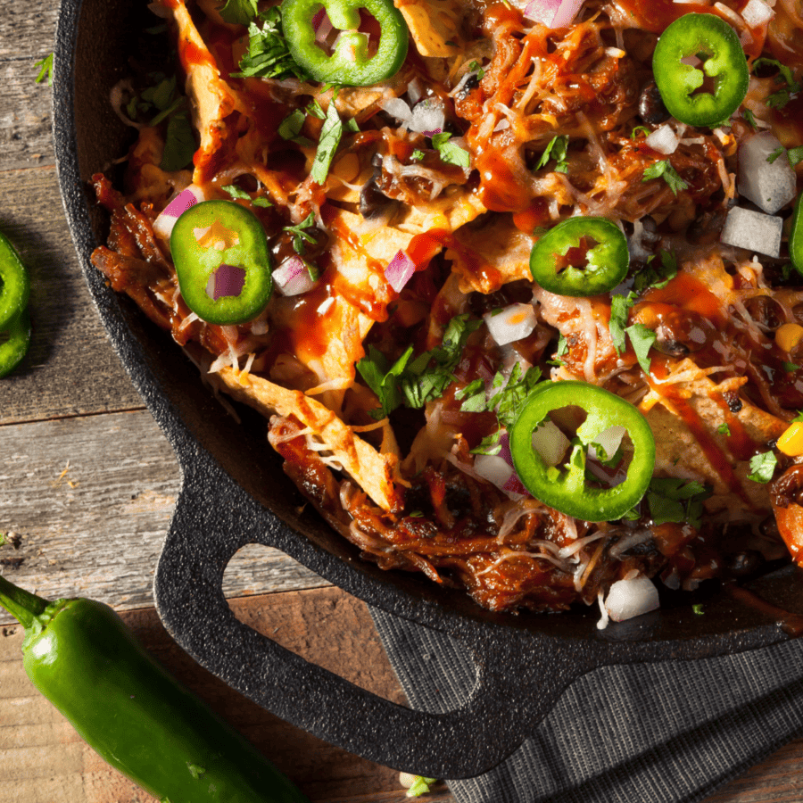 Close up image of BBQ Chicken Nachos in a pan