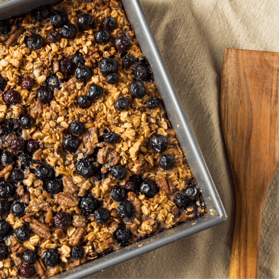 overhead image of blueberry baked oatmeal in a square pan
